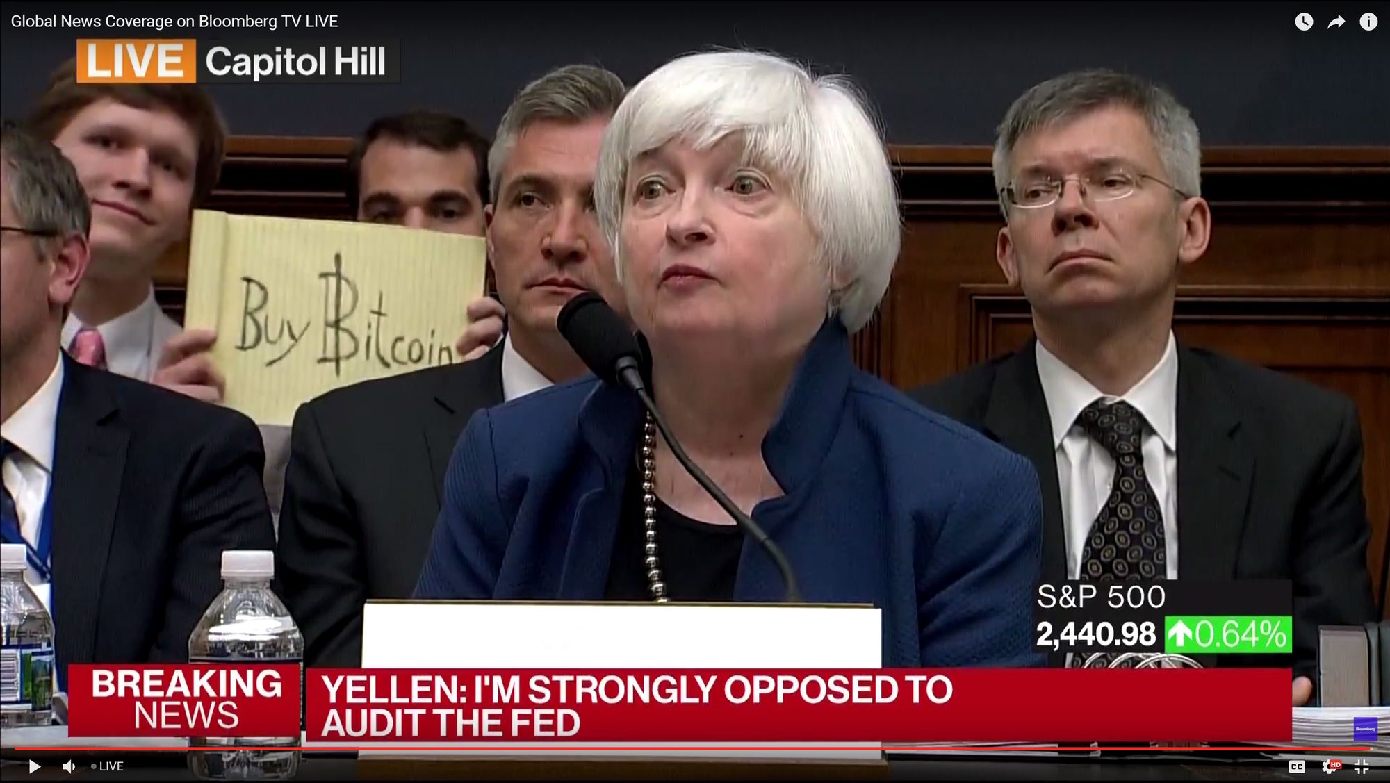 Incoming Treasury Secretary Janet Yellen with a "Buy Bitcoin" prankster in 2017.